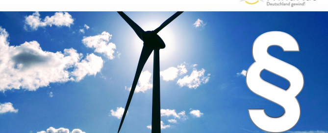 Auf dem Bild ist ein Windrat und ein Gesetzesparagraf zu sehen.